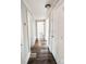 Hallway featuring luxury vinyl plank flooring and neutral paint colors with access to other rooms at 32884 Old Salisbury Rd, Albemarle, NC 28001