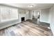 Cozy living room featuring a fireplace, natural light and new floors at 32884 Old Salisbury Rd, Albemarle, NC 28001