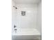 Nicely tiled shower and bathtub combination with a decorative mosaic tile inset shelf at 32884 Old Salisbury Rd, Albemarle, NC 28001