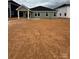 View of the new backyard and back of home, featuring a covered porch at 338 Knotty Wood Dr # 69, Monroe, NC 28110