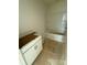 Unfinished bathroom with tub, shower, vanity, and cabinet in white at 338 Knotty Wood Dr # 69, Monroe, NC 28110