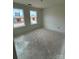 Unfinished bedroom with two windows and neutral walls and flooring at 338 Knotty Wood Dr # 69, Monroe, NC 28110