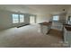 Bright kitchen with ample space features an island and white cabinetry, ready for customization at 338 Knotty Wood Dr # 69, Monroe, NC 28110