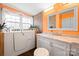 Elegant bathroom with a luxurious tub, stylish vanity, and ample lighting, offering a spa-like experience at 390 Rocky Rick Rd, Rockwell, NC 28138