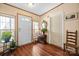 Welcoming foyer with natural light, hardwood floors, and decorative accents offers an inviting first impression at 390 Rocky Rick Rd, Rockwell, NC 28138