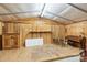 Inside the garage showcasing a loft-like space and wooden walls at 390 Rocky Rick Rd, Rockwell, NC 28138