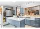 Eat-in kitchen features a modern design, stainless steel appliances, and views to the dining room at 390 Rocky Rick Rd, Rockwell, NC 28138