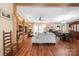 Open floor plan with a living room and dining room area with hardwood floors and natural light at 390 Rocky Rick Rd, Rockwell, NC 28138