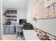 Bright office features built-in shelves, tiled accents, and a modern desk, creating a functional workspace at 390 Rocky Rick Rd, Rockwell, NC 28138