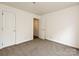 Neutral bedroom with two doors and plush carpet flooring at 521 N Graham St # 2B, Charlotte, NC 28202