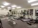 Community gym with various machines, weights, and ample mirrors at 521 N Graham St # 2B, Charlotte, NC 28202