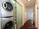 Hallway with washer and dryer, and storage area at 521 N Graham St # 2B, Charlotte, NC 28202
