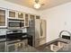 Updated kitchen featuring stainless steel appliances and sleek granite countertops at 521 N Graham St # 2B, Charlotte, NC 28202