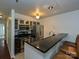 Modern kitchen featuring stainless steel appliances, granite countertops, and bar seating at 521 N Graham St # 2B, Charlotte, NC 28202