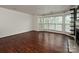 Well-lit living room showcasing hardwood floors, fireplace, and bright bay windows at 521 N Graham St # 2B, Charlotte, NC 28202