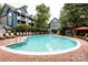 Large community pool with chairs for lounging, plus shade umbrella at 521 N Graham St # 2B, Charlotte, NC 28202