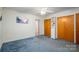 Carpeted bedroom with wooden closet doors, bright with natural light, and ready for personalization at 816 S Point Rd, Belmont, NC 28012