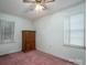 Cozy bedroom featuring a ceiling fan and light filled windows at 816 S Point Rd, Belmont, NC 28012