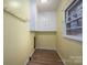 Bonus room with hardwood floors and built-in white cabinets at 816 S Point Rd, Belmont, NC 28012