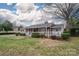 Charming single-story home featuring a welcoming front porch and beautifully landscaped front yard at 816 S Point Rd, Belmont, NC 28012