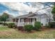 Charming single-story home with brick and vinyl siding and landscaped yard at 816 S Point Rd, Belmont, NC 28012