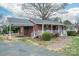 Charming single-story brick home with carport, front porch, and landscaped walkway at 816 S Point Rd, Belmont, NC 28012