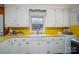 Charming kitchen featuring white cabinets, a retro-style countertop, and ample storage at 816 S Point Rd, Belmont, NC 28012