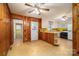 Retro style eat-in kitchen features wood paneling and white appliances at 816 S Point Rd, Belmont, NC 28012