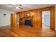 Comfortable living room with wood paneling and a view of the kitchen at 816 S Point Rd, Belmont, NC 28012