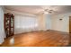 Spacious living room featuring hardwood floors and large windows for natural light at 816 S Point Rd, Belmont, NC 28012
