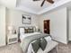 Beautiful bedroom with decorative tray ceiling and a calming neutral color palette at 8925 Rosalyn Glen Rd, Cornelius, NC 28031