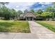 Charming exterior view of the community clubhouse and lush green lawn at 8925 Rosalyn Glen Rd, Cornelius, NC 28031