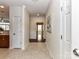 Inviting hallway with tile flooring and a view into other rooms of the home at 8925 Rosalyn Glen Rd, Cornelius, NC 28031