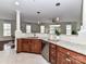 Open concept kitchen with stainless steel appliances and granite countertops overlooking the living area at 8925 Rosalyn Glen Rd, Cornelius, NC 28031