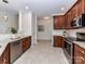 Open kitchen with stainless steel appliances, tile backsplash, and tile flooring at 8925 Rosalyn Glen Rd, Cornelius, NC 28031