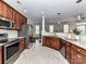 Open concept kitchen with stainless steel appliances, granite counters, and tile backsplash at 8925 Rosalyn Glen Rd, Cornelius, NC 28031