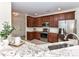 Spacious kitchen with stainless steel appliances, granite countertops, and ample cabinet space at 8925 Rosalyn Glen Rd, Cornelius, NC 28031