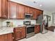 Updated kitchen with stainless steel appliances, granite counters, and subway tile backsplash at 8925 Rosalyn Glen Rd, Cornelius, NC 28031