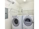 Well-equipped laundry room with a stacked washer and dryer, and wire shelving at 8925 Rosalyn Glen Rd, Cornelius, NC 28031