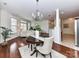 Open concept living room and dining room area with hardwood floors and natural light at 8925 Rosalyn Glen Rd, Cornelius, NC 28031