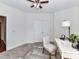 Home office with a decorative ceiling fan and a bright desk area at 8925 Rosalyn Glen Rd, Cornelius, NC 28031