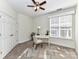 Home office with a decorative ceiling fan and a desk by the window at 8925 Rosalyn Glen Rd, Cornelius, NC 28031
