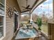 Relaxing covered patio with a ceiling fan, outdoor furniture, and views of the backyard at 8925 Rosalyn Glen Rd, Cornelius, NC 28031