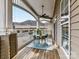 Cozy covered patio features a ceiling fan, stylish outdoor furniture, and a welcome sign at 8925 Rosalyn Glen Rd, Cornelius, NC 28031