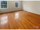 Bright room featuring hardwood floors and natural light, offering a versatile space at 9105 Capsdale Ct, Huntersville, NC 28078