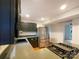 The spacious kitchen is equipped with stainless steel appliances, modern dark cabinetry, and a cooktop island at 9105 Capsdale Ct, Huntersville, NC 28078