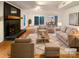 Bright living room with hardwood floors, a fireplace, and an open layout perfect for entertaining at 9105 Capsdale Ct, Huntersville, NC 28078