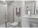 Updated bathroom with glass shower door, toilet, and sink with vanity and mirror at 111 Old Field Rd, Statesville, NC 28677