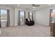Bright bedroom features neutral carpet, natural light from two windows and ceiling fan at 111 Old Field Rd, Statesville, NC 28677