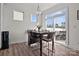 Cozy breakfast nook with a dark wooden table, four chairs, and a sliding glass door at 111 Old Field Rd, Statesville, NC 28677